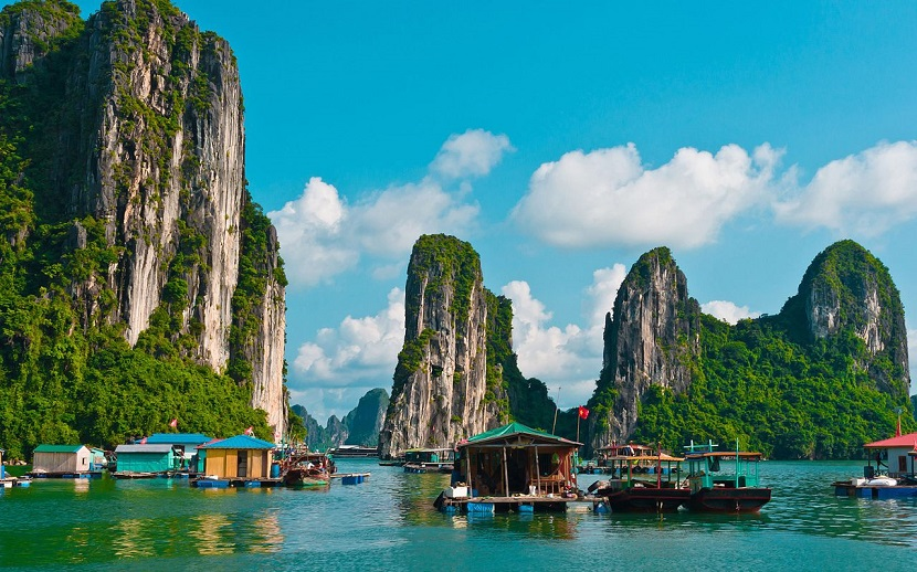Caves and fish village in Ha Long bay