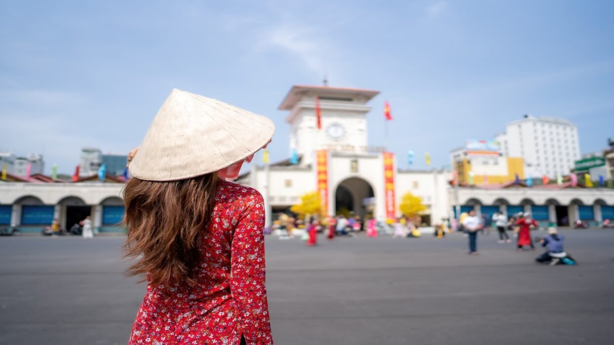 Vietnamese,Girl,With,Ao,Dai,Dress,Walking,In,Front,Of